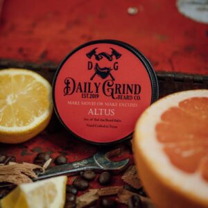 Beard balm with citrus and coffee beans for grooming and skincare.